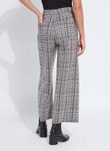 Load image into Gallery viewer, Model wearing lush tweed textured wide-leg pants, black top and black boots against a white background.