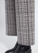 Load image into Gallery viewer, Close-up of bottom half of lush tweed textured pant and black boots against a white background.