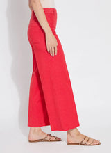 Load image into Gallery viewer, Elevate your wardrobe with the Lysse Erin Pintuck Reprieve Denim, designed for effortless style and all-day comfort. Featuring a 27-inch inseam, this sleek pant offers a flattering fit with a touch of sophistication. The pintuck detailing adds a refined edge, while the striking red hue makes a bold statement.