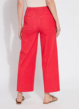Load image into Gallery viewer, Elevate your wardrobe with the Lysse Erin Pintuck Reprieve Denim, designed for effortless style and all-day comfort. Featuring a 27-inch inseam, this sleek pant offers a flattering fit with a touch of sophistication. The pintuck detailing adds a refined edge, while the striking red hue makes a bold statement.