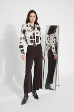 Load image into Gallery viewer, Crafted from 4-way stretch Knit Denim, these jeans boast a high-waisted, wide-leg cut with a concealed patented waistband, back patch pockets adorned with gunmetal studs, belt loops, and topstitching. The Erin High Waist Wide Leg Denim offers an extra-wide leg without side seams, presenting a cropped, ankle-length design with a raw-edge hem that can be easily shortened.