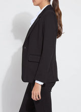 Load image into Gallery viewer, Woman wearing a black blazer, white blouse and black pant against a white background.