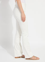 Load image into Gallery viewer, Model wearing white denim and beige sandals against a plain background.