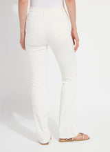 Load image into Gallery viewer, Model wearing white denim and beige sandals against a plain background.