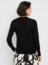 Load image into Gallery viewer, The Nic & Zoe Evie Evening Petal Sweater in Black Multi is a sophisticated pullover that combines elegance with comfort. Featuring a knit-in intarsia pattern, this sweater showcases a striking black-and-white design with scalloped neck trim for a feminine touch. The lightweight fabric ensures ease of wear, while the regular fit and long sleeves make it perfect for layering. Designed to sit at the hip, this sweater is versatile enough for both casual outings and dressier occasions.