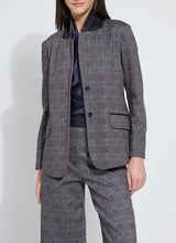Load image into Gallery viewer, Woman wearing a grey checkered suit with a blue top posing against a white background.