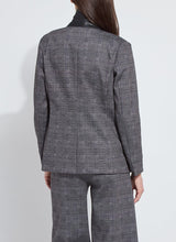Load image into Gallery viewer, Woman wearing grey plaid suit posing against a white background.