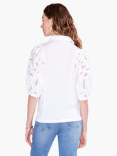 Load image into Gallery viewer, An embroidered top loaded with detail, this shirt is a must-have for casual denim looks and elevated outfits alike. Signature embroidery details and negative space on the puff sleeves add texture and interest to your look. Elastic at the short sleeve openings add extra shape. Wear it with the collar popped to add some attitude. With a classic button front and a hem designed to sit at the hip. Color- Paper white. Regular fit. Shirt collar. Short sleeve.