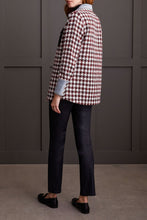 Load image into Gallery viewer, The Fantasia Shacket offers a chic update to your autumn collection. Showcasing a classic plaid design in a striking mix of red, black, and white, it boasts eye-catching accents with denim cuffs and collar, along with faux leather pockets secured by fancy buttons. Ideal for the brisk weather, this shacket promises to keep you warm and fashionable.