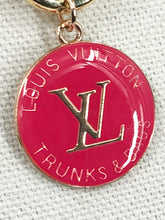 Load image into Gallery viewer, This vibrant and striking vintage Louis Vuitton Zipper Pull necklace is sure to catch everyone's eye. It's a stunning and distinctive piece, with a hot pink hue that gleams against the glossy gold chain.