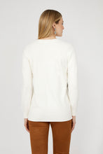 Load image into Gallery viewer, Woman wearing a white sweater and brown pants against a plain background.