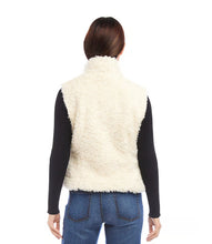 Load image into Gallery viewer, Indulge in luxury with our Faux Shearling Vest. Made from plush, faux shearling, this vest provides warmth and style all season long. Its versatile design enhances any outfit, from dresses to turtlenecks and jeans.