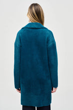 Load image into Gallery viewer, Embrace the cooler seasons with this snug feather yarn sweater coat in a stunning twilight blue shade. Featuring a convenient mid-thigh length, single-button closure, and flap pockets, this garment transitions seamlessly from daytime to evening wear.