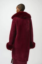 Load image into Gallery viewer, Woman wearing burgundy coat with fur trim against a white background.