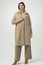 Load image into Gallery viewer, Woman wearing a long warm taupe coat with detachable faux fur and brooch, taupe jeans and taupe suede boots against a white background.