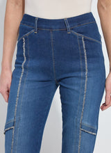 Load image into Gallery viewer, Close-up of fringe blue jeans against a white background.