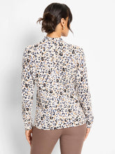 Load image into Gallery viewer, Woman wearing a cheetah print sweater and taupe pants against a white backdrop.