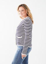 Load image into Gallery viewer, Experience comfort and style with this essential addition for a sophisticated appearance. Wear it unbuttoned over your preferred top or buttoned up for a refined look. The classic white and navy stripes offer a timeless appeal. Easily dressed up or down for any occasion. Color- White and navy stripe. Front button closure. Round neck. Long sleeves.
