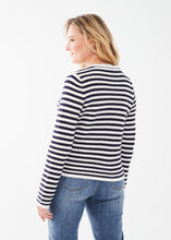 Load image into Gallery viewer, Experience comfort and style with this essential addition for a sophisticated appearance. Wear it unbuttoned over your preferred top or buttoned up for a refined look. The classic white and navy stripes offer a timeless appeal. Easily dressed up or down for any occasion. Color- White and navy stripe. Front button closure. Round neck. Long sleeves.