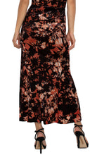Load image into Gallery viewer, The fit-and-flare silhouette of this skirt is designed to flatter your curves, ensuring a comfortable fit and easy wearability. Its lining creates a smooth drape across the body, while the intricate burnout pattern offers an eye-catching and sophisticated detail.