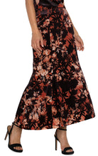 Load image into Gallery viewer, The fit-and-flare silhouette of this skirt is designed to flatter your curves, ensuring a comfortable fit and easy wearability. Its lining creates a smooth drape across the body, while the intricate burnout pattern offers an eye-catching and sophisticated detail.