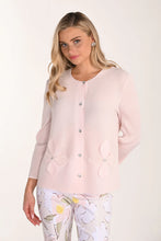Load image into Gallery viewer, Woman wearing a light pink cardigan over floral pants on a white background.