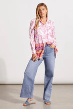 Load image into Gallery viewer, Add a dash of fresh floral fun to your wardrobe with this long-sleeve button-up featuring a border print on its lower half. High slits, an elegant bal collar, and stretch-infused fabric make this a winning choice. Wear long, closed or open or tied at the waist.