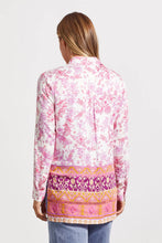 Load image into Gallery viewer, Add a dash of fresh floral fun to your wardrobe with this long-sleeve button-up featuring a border print on its lower half. High slits, an elegant bal collar, and stretch-infused fabric make this a winning choice. Wear long, closed or open or tied at the waist.
