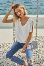 Load image into Gallery viewer, These dazzling blue denim jeans feature intricate floral embroidery, adding a feminine touch to the classic design. Our Freesia offers a soft, stretchy feel that ensures all-day comfort. The jeans are designed with a flattering fit, making them perfect for casual summer occasions.