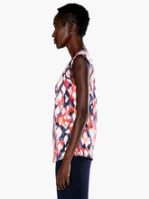 Load image into Gallery viewer, A pattern inspired by the garden in bloom, throw on this tank in our fan favorite Live In fabric and your look will blossom too. With a band collar and raglan sleeve details that add some sophisticated shape to the bright look, this top is the garden party you can wear. The hem falls slightly below the hip and we've added a touch of stretch to keep you extra comfortable. Color-Blue Multi.