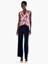 Load image into Gallery viewer, A pattern inspired by the garden in bloom, throw on this tank in our fan favorite Live In fabric and your look will blossom too. With a band collar and raglan sleeve details that add some sophisticated shape to the bright look, this top is the garden party you can wear. The hem falls slightly below the hip and we've added a touch of stretch to keep you extra comfortable. Color-Blue Multi.