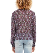 Load image into Gallery viewer, This gorgeous top is crafted with a soft crinkled knit fabric that drapes and flatters. It features a V-neckline, long cuffed sleeves, and a loose fit. Shimmering metallic threading glistens among the floral pattern and really draws the eye. The timeless tie front hemline completes the look. Color- Shades of purple and metallic. Metallic crinkled knit fabrication. V-neckline. Long cuffed sleeves. Loose fit. Tie front hemline.