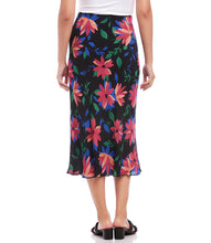 Load image into Gallery viewer, A vibrant floral print enhances the romantic charm of this swingy bias cut skirt in a stylish midi length. It features an easy pull-on silhouette that flows away from the body in streamlined sophistication. Colors- Black, blue, green, pinks. Lined. Bias cut. Elasticized waistband. Fabric- 100% Rayon. Care- Dry clean.