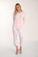 Load image into Gallery viewer, Woman wearing a light pink sweater and blush floral crop pants and silver sandals on a white background.