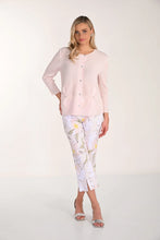 Load image into Gallery viewer, Woman wearing a light pink sweater and blush floral crop pants and silver sandals on a white background.