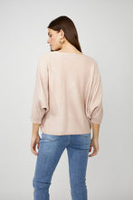 Load image into Gallery viewer, Nothing embodies spring quite like flowers, and our Fallon top is the perfect spring style with its textured raised floral design. This chic sweater showcases flowers adorned with shimmering gold embellishments, ensuring you stand out in any crowd. The lightweight blush fabric has a slight sheen, adding an elevated touch to your look. With its crewneck and versatile style, it's perfect for both casual outings and special occasions.