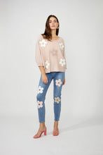 Load image into Gallery viewer, Nothing embodies spring quite like flowers, and our Fallon top is the perfect spring style with its textured raised floral design. This chic sweater showcases flowers adorned with shimmering gold embellishments, ensuring you stand out in any crowd. The lightweight blush fabric has a slight sheen, adding an elevated touch to your look. With its crewneck and versatile style, it's perfect for both casual outings and special occasions.