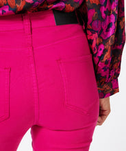 Load image into Gallery viewer, Let your fashion sense come alive with our Fuchsia Colored Flair Denim Trousers. With a modern construction and flair cut, these trousers deliver a bold, feminine style. Offering a flattering fit, EsQualo's quality denim fabric ensures this denim trouser remains comfortable to wear. Not limited to any one look, match our Felizia with a relaxed top or chic blouse for a unique, hassle-free ensemble.