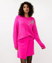 Load image into Gallery viewer, Expertly crafted, the Esqualo Cerise Pink Sweater perfectly combines comfort and sophistication. This oversized, cozy garment is embellished with elegant rhinestones, adding a touch of glamour to any outfit. It will make a statement while keeping you warm. Pair it effortlessly with jeans or skirts for a head-turning look.