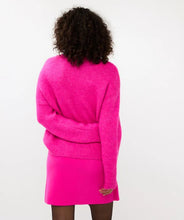Load image into Gallery viewer, Expertly crafted, the Esqualo Cerise Pink Sweater perfectly combines comfort and sophistication. This oversized, cozy garment is embellished with elegant rhinestones, adding a touch of glamour to any outfit. It will make a statement while keeping you warm. Pair it effortlessly with jeans or skirts for a head-turning look.