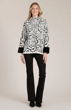 Load image into Gallery viewer, Stand out in style with this Frady Funnel Abstract Cape from Tyler and Boe. The black and white design exudes a modern but classic feel, while the faux fur trim adds a touch of luxury. You definitely will make a fashion statement when you walk into a room wearing this gorgeous top.