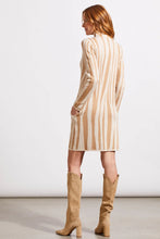 Load image into Gallery viewer, This funnel neck sweater dress is the epitome of modern elegance, offering a harmonious mix of avant-garde fashion and unparalleled comfort. Its striking jacquard pattern ensures you stand out in any crowd, complemented by the refined look of set-in long sleeves and a gently contoured silhouette. The functional side pockets, accented with contrasting trim, add a dash of visual flair.