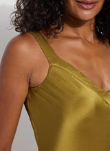 Load image into Gallery viewer, The Lyssé Gemma Silk Slip Dress is a luxurious and elegant piece designed for effortless sophistication. Crafted from high-quality polyester, this slip dress offers a smooth, lightweight, satin feel that drapes beautifully on the body. The Manzanilla color adds a rich, warm tone, making it perfect for both casual and formal occasions.