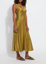 Load image into Gallery viewer, The Lyssé Gemma Silk Slip Dress is a luxurious and elegant piece designed for effortless sophistication. Crafted from high-quality polyester, this slip dress offers a smooth, lightweight, satin feel that drapes beautifully on the body. The Manzanilla color adds a rich, warm tone, making it perfect for both casual and formal occasions.
