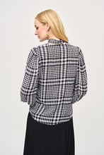 Load image into Gallery viewer, Crafted from exquisite georgette material, this black and white plaid top with dots of color, exudes elegance and sophistication, making it the perfect addition to any outfit. The V-neckline is adorned with a charming scarf tied at the center, adding a touch of refinement to this modern piece. The long puff sleeves with cuffs add a playful touch, while exuding confidence in this delightful top.