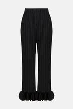 Load image into Gallery viewer, Black pleated pants with circle appliques at the bottom hems against a white background.