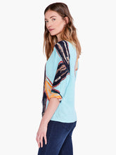 Load image into Gallery viewer, An eye-catching print that speaks to nature and time spent outdoors, printed on top of our feather knit fabric, a super comfortable linen blend. This pullover top features a modern, relaxed fit, a widened boat neck, generous dolman sleeves that reach to the elbow, and a hem that sits at the hip. Color-Aqua Multi. Pullover sweater. Lightweight. Relaxed fit. Boatneck. Elbow sleeve.