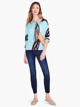Load image into Gallery viewer, An eye-catching print that speaks to nature and time spent outdoors, printed on top of our feather knit fabric, a super comfortable linen blend. This pullover top features a modern, relaxed fit, a widened boat neck, generous dolman sleeves that reach to the elbow, and a hem that sits at the hip. Color-Aqua Multi. Pullover sweater. Lightweight. Relaxed fit. Boatneck. Elbow sleeve.