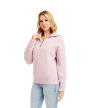 Load image into Gallery viewer, Woman wearing a pink half-zip sweater and light blue jeans against a white background.