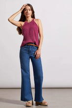 Load image into Gallery viewer, Woman wearing plum ribbed texture sweater halter top, blue jeans with belt and wedge sandals against a white background.